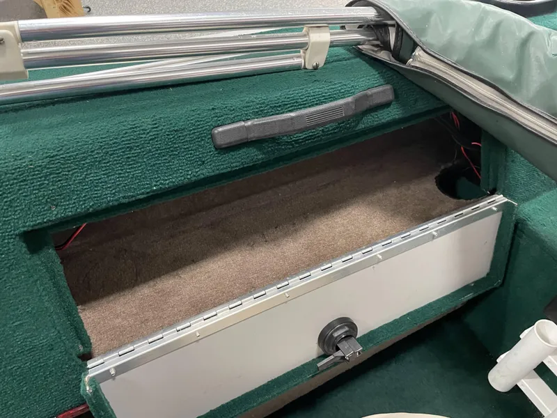 Slide: The Image of 2000 Starcraft Superfisherman 176 DC dashboard with steering wheel and gauges. - 38