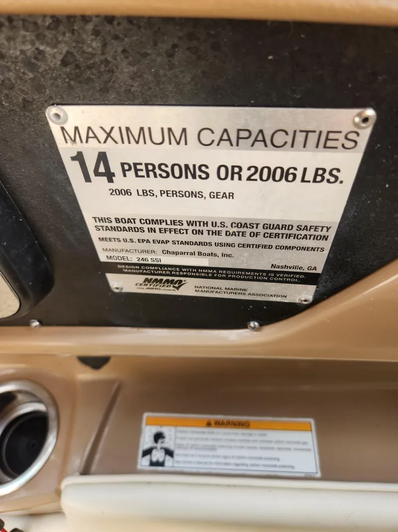 Slide: The Image of Capacity label on 2016 Chaparral 246 SSi boat, maximum 14 persons or 2006 lbs. - 13