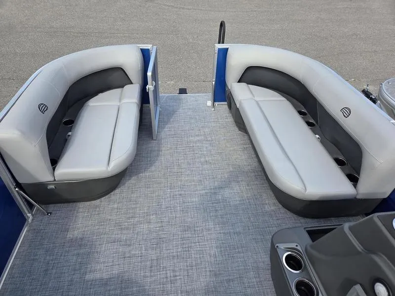 Slide: The Image of 2026 Sun Tracker PB 16 DLX pontoon boat interior with gray seating and cup holders. - 8