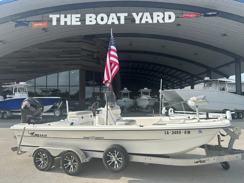 Slide: The Image of 2021 Mako Pro Skiff 19 CC boat on trailer at The Boat Yard dealership. - 0