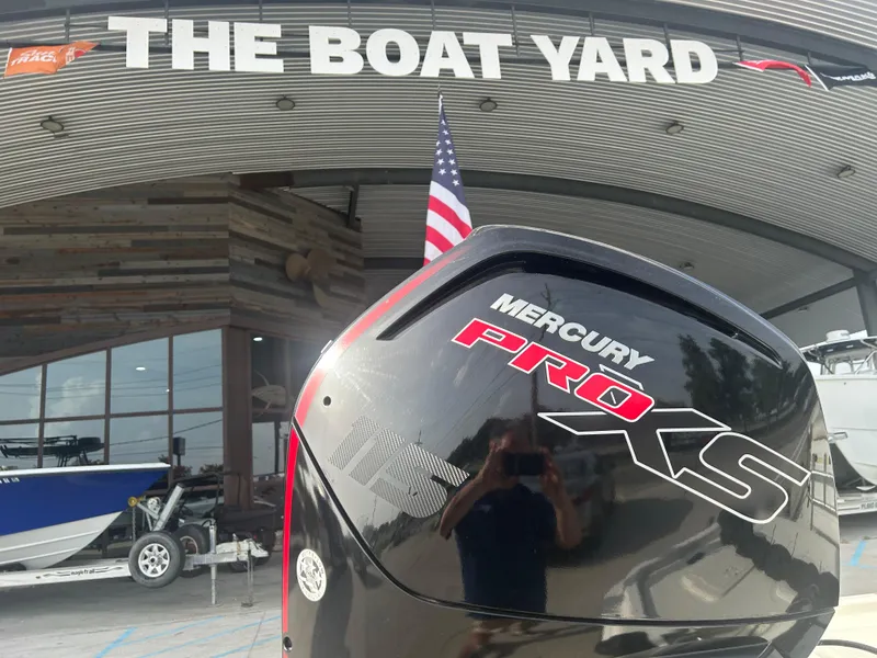 Slide: The Image of Mercury Pro XS engine at The Boat Yard, featuring a 2021 Mako Pro Skiff 19 CC. - 1