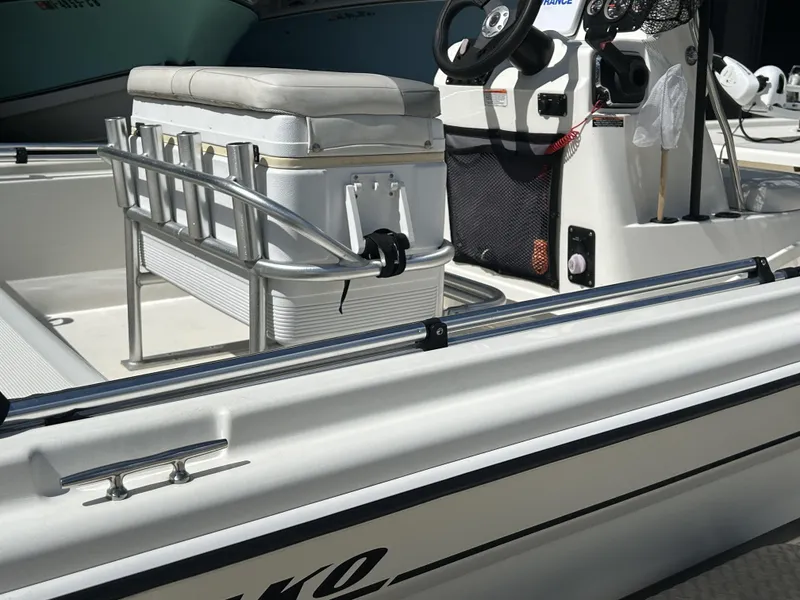Slide: The Image of 2021 Mako Pro Skiff 19 CC boat interior with steering console and seating. - 10