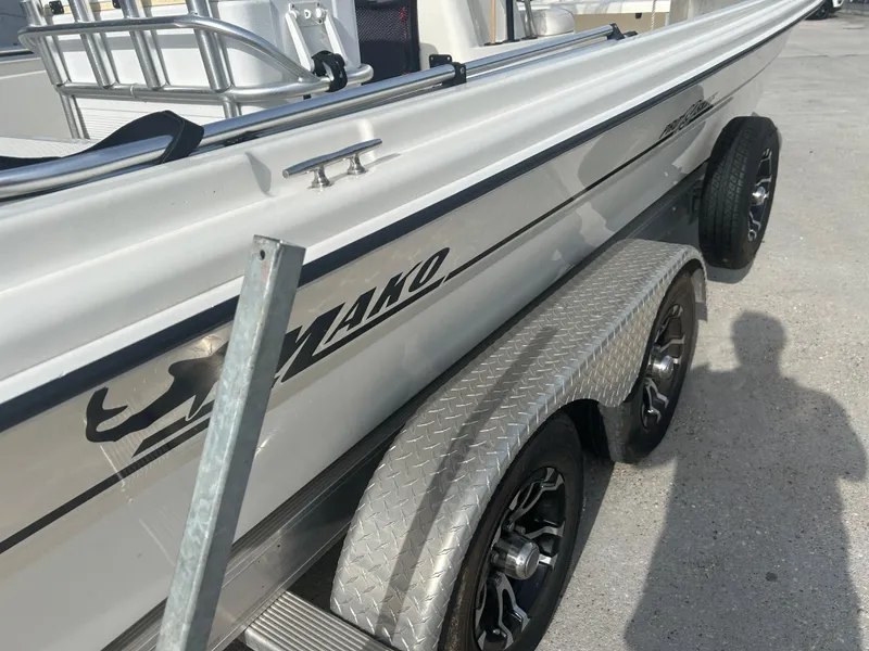 Slide: The Image of 2021 Mako Pro Skiff 19 CC boat on trailer, side view with logo visible. - 11