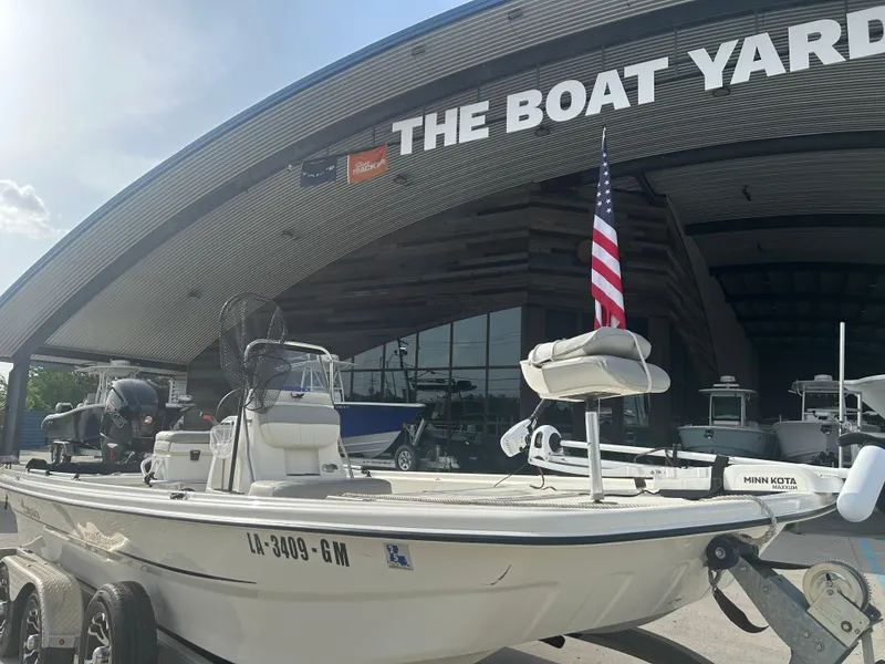 Slide: The Image of 2021 Mako Pro Skiff 19 CC boat displayed at The Boat Yard dealership. - 6