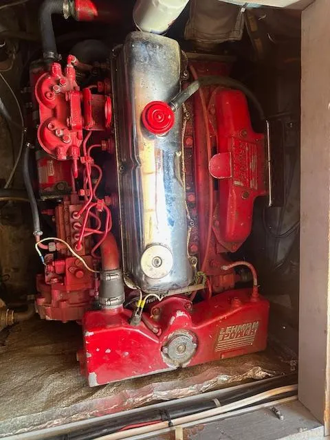 Slide: The Image of Red marine engine in 1985 Eagle Trawler, showcasing detailed mechanical components. - 8