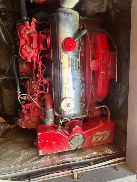 Slide: The Image of Red engine in a 1985 Eagle Trawler boat, showcasing mechanical components. - 9