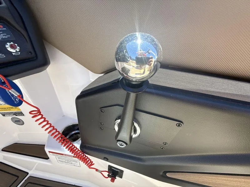 Slide: The Image of 2021 Moomba Mojo boat throttle control with reflective chrome knob and safety lanyard. - 16