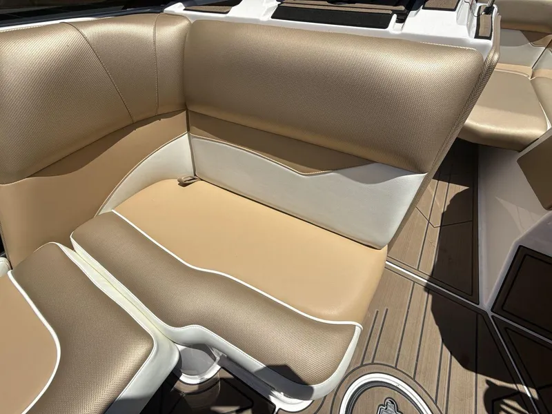 Slide: The Image of 2021 Moomba Mojo boat interior with tan and white seating. - 17