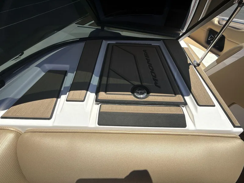 Slide: The Image of 2021 Moomba Mojo boat interior with tan and black accents. - 18