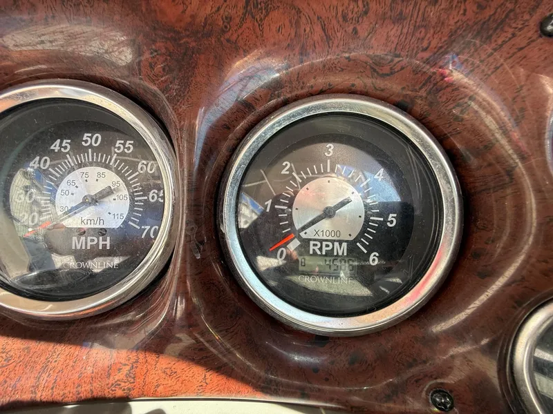Slide: The Image of Dashboard gauges of a 2009 Crownline 270 BR boat showing speed and RPM. - 16