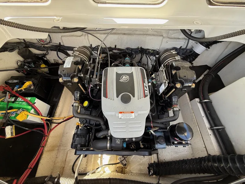 Slide: The Image of Engine compartment of a 2009 Crownline 270 BR boat, featuring a MerCruiser engine. - 31