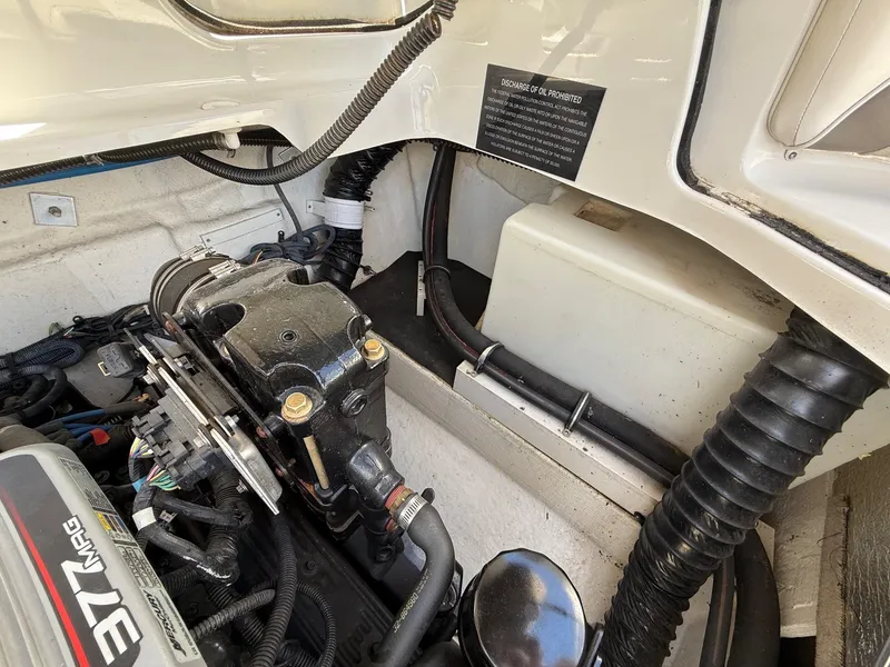 Slide: The Image of Engine compartment of a 2009 Crownline 270 BR boat, showcasing mechanical components. - 33