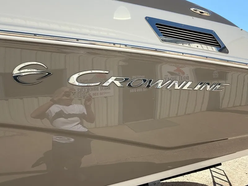 Slide: The Image of 2009 Crownline 270 BR boat with reflective exterior and logo. - 6