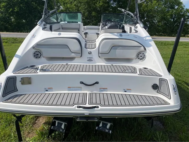 Slide: The Image of 2015 Yamaha Boats 212X rear view, featuring swim platform and seating. - 5