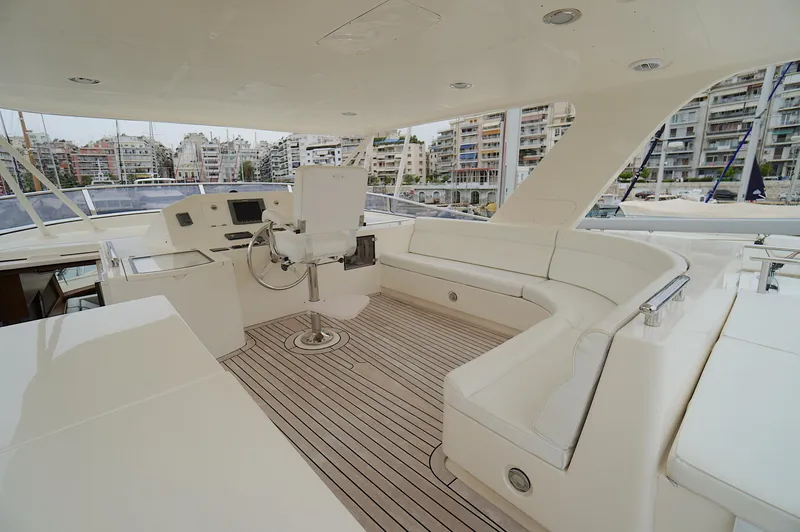 Slide: The Image of Luxurious 2009 Marlow 61E yacht interior with spacious seating and modern helm. - 17