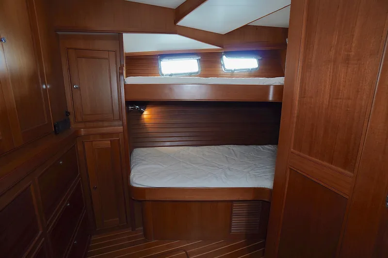 Slide: The Image of Wooden interior cabin with bunk beds in 2009 Marlow 61E yacht. - 28