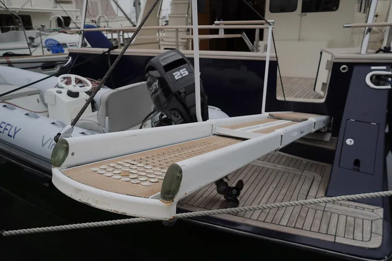 Slide: The Image of Boarding platform of a 2009 Marlow 61E yacht with outboard motor and tender. - 3