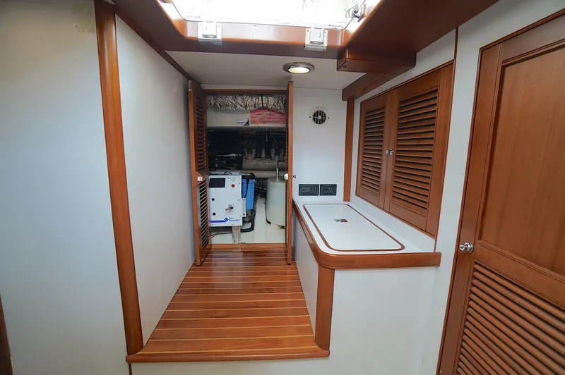 Slide: The Image of Interior of 2009 Marlow 61E yacht with wooden flooring and cabinetry. - 40
