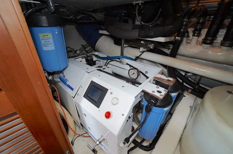 Slide: The Image of Engine room of a 2009 Marlow 61E yacht with water filtration system. - 41