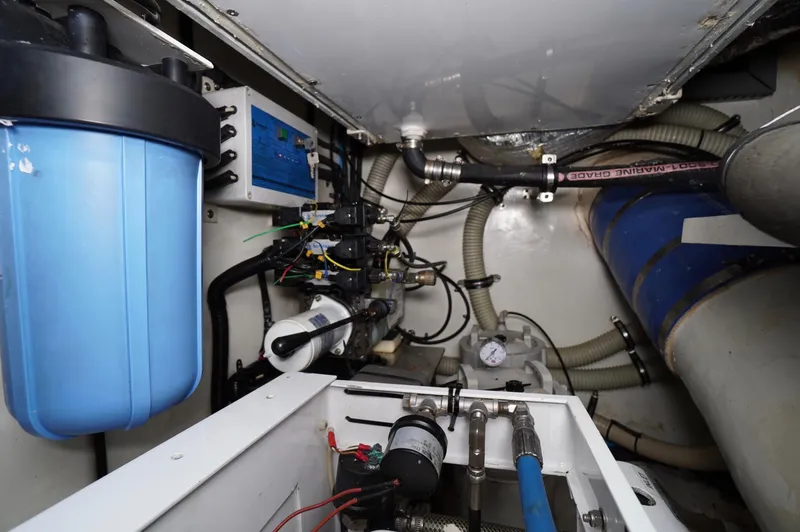 Slide: The Image of Engine room of a 2009 Marlow 61E yacht with various mechanical components. - 44