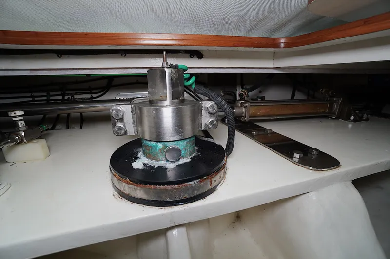 Slide: The Image of Mechanical component inside a 2009 Marlow 61E yacht, featuring metal and wiring elements. - 47