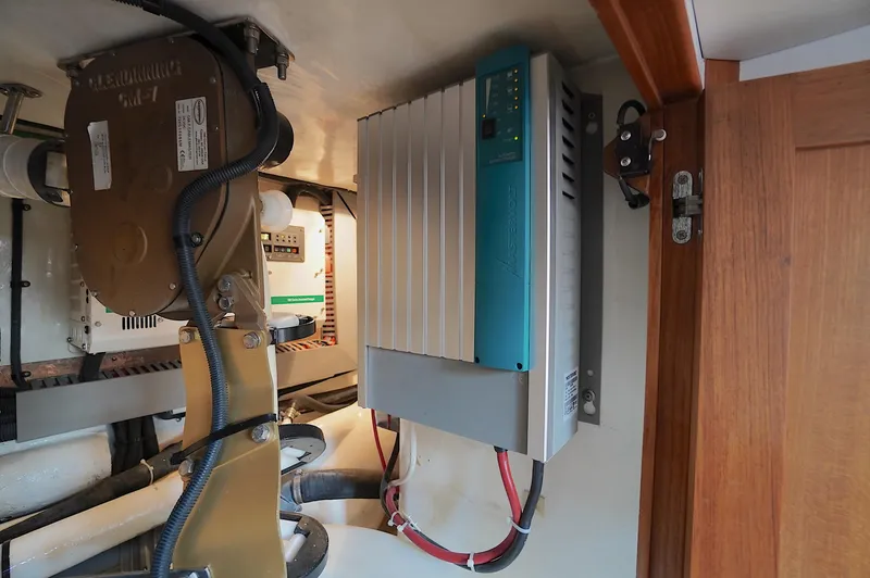 Slide: The Image of Electrical system inside a 2009 Marlow 61E yacht, featuring wiring and components. - 48