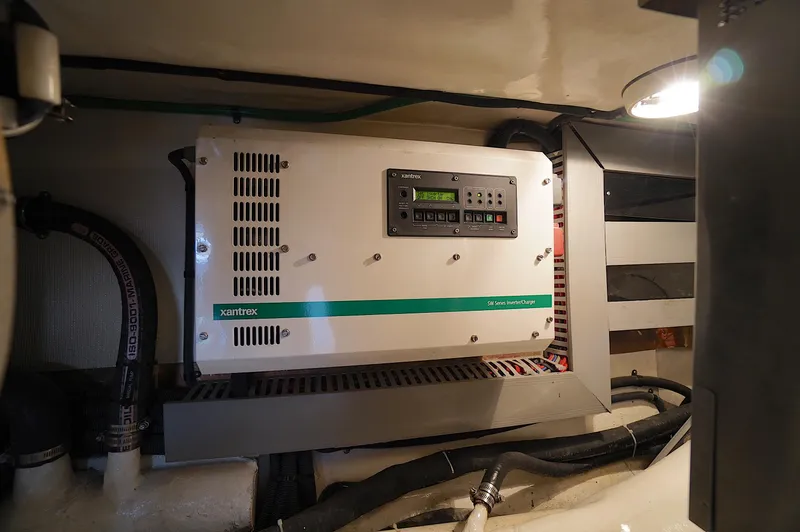 Slide: The Image of Electrical system in a 2009 Marlow 61E yacht featuring a Xantrex inverter/charger. - 49