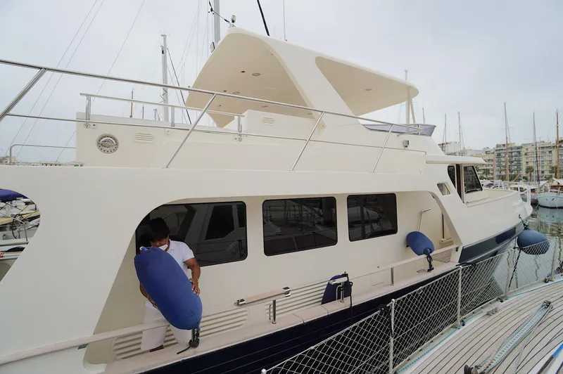 Slide: The Image of Luxury Marlow 61E yacht docked at marina, 2009 model. - 5