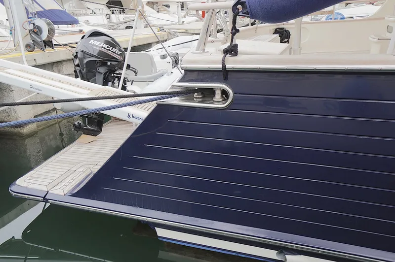 Slide: The Image of Sleek 2009 Marlow 61E yacht with Mercury outboard motor at marina. - 7