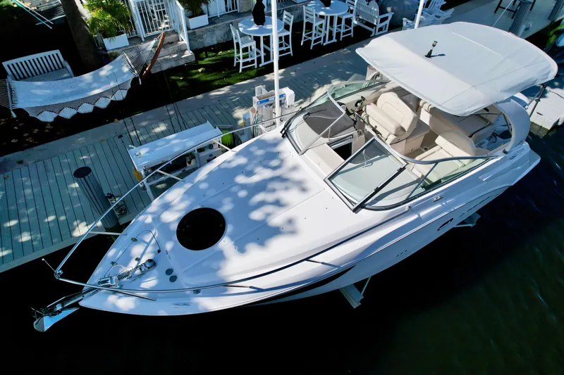 Slide: The Image of 2021 Regal 26 XO boat docked, featuring sleek design and spacious seating. - 20