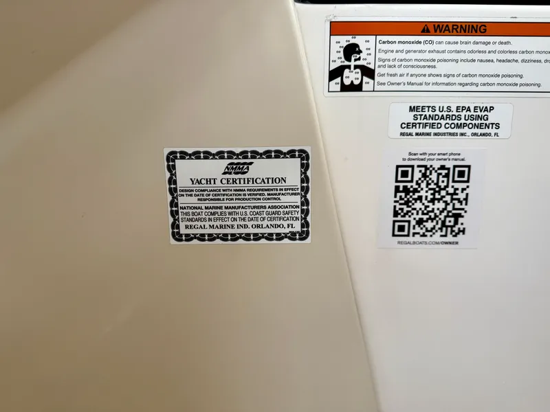 Slide: The Image of 2021 Regal 26 XO yacht certification and safety warning labels with QR code. - 58