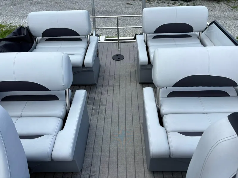 Slide: The Image of 2024 Bentley Pontoons Legacy QSB interior with luxurious seating arrangement. - 14