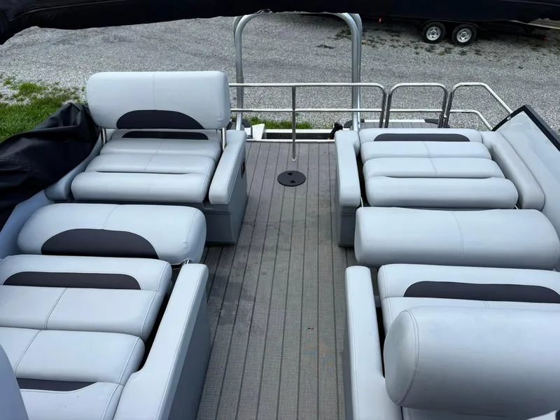 Slide: The Image of 2024 Bentley Pontoons Legacy QSB interior with luxurious seating arrangement. - 15