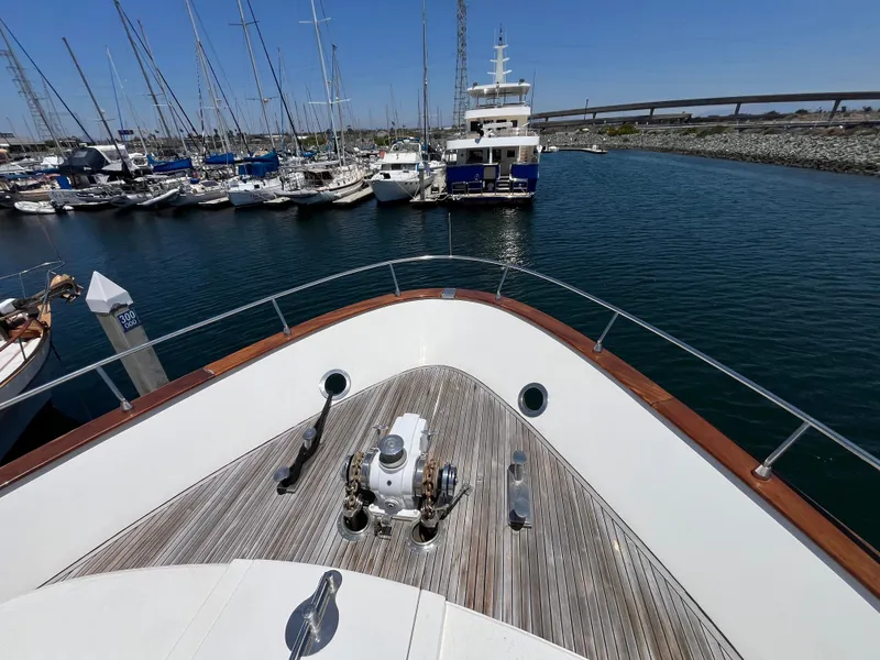 Slide: The Image of Bow view of 2001 Astondoa 95GLX yacht docked in a marina. - 16