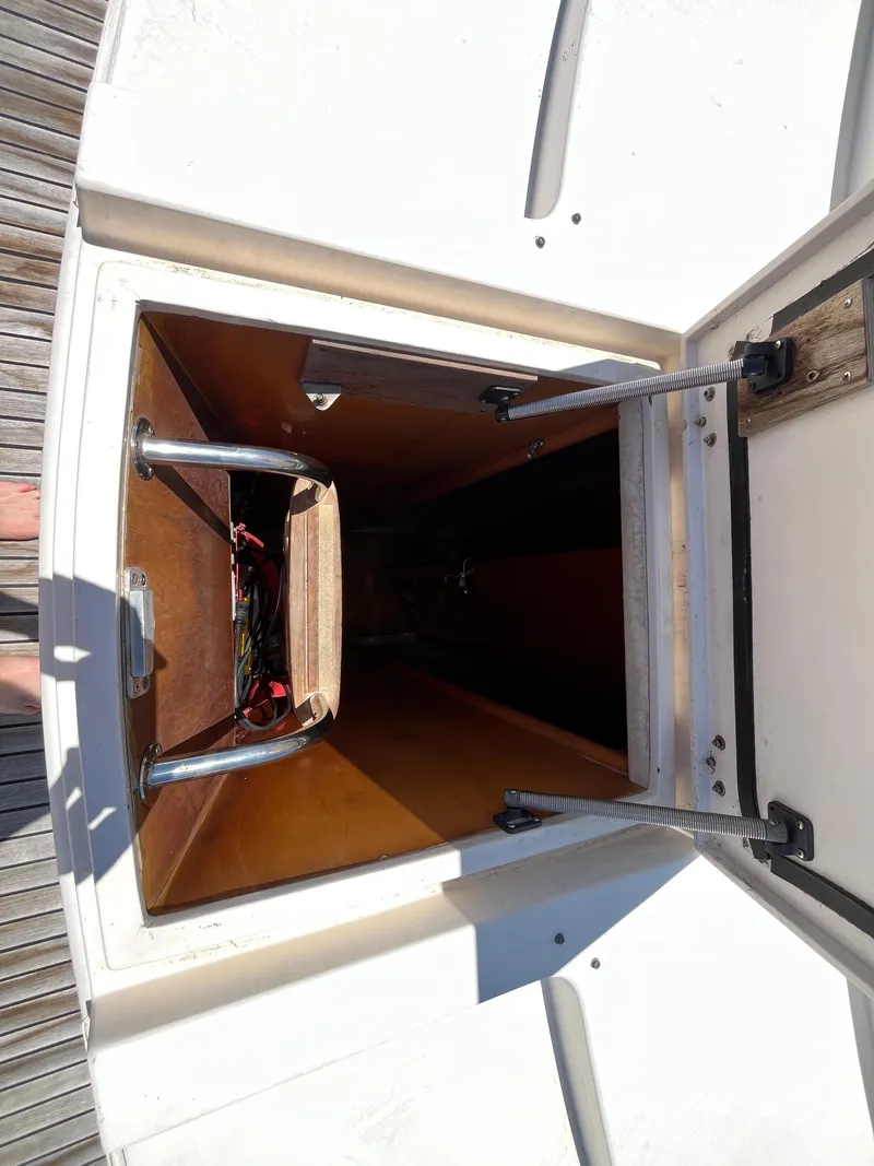 Slide: The Image of Open storage compartment on a 2001 Astondoa 95GLX yacht, showing interior details. - 17