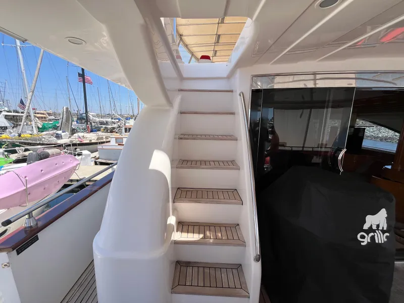 Slide: The Image of Staircase on 2001 Astondoa 95GLX yacht, docked at marina with boats in background. - 20