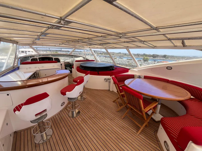 Slide: The Image of Luxurious 2001 Astondoa 95GLX yacht deck with seating, bar, and jacuzzi. - 21