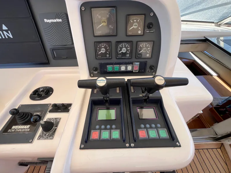 Slide: The Image of Control panel of a 2001 Astondoa 95GLX yacht with MTU and Raymarine systems. - 27
