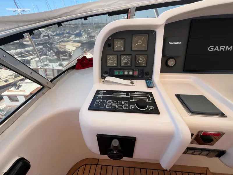 Slide: The Image of Control panel of a 2001 Astondoa 95GLX yacht with navigation instruments. - 28