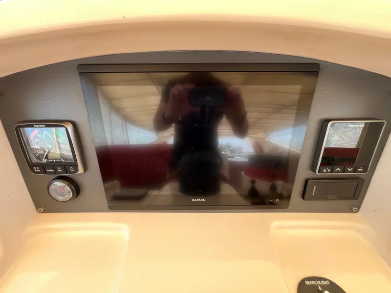 Slide: The Image of Control panel of a 2001 Astondoa 95GLX yacht with Garmin and Raymarine displays. - 29