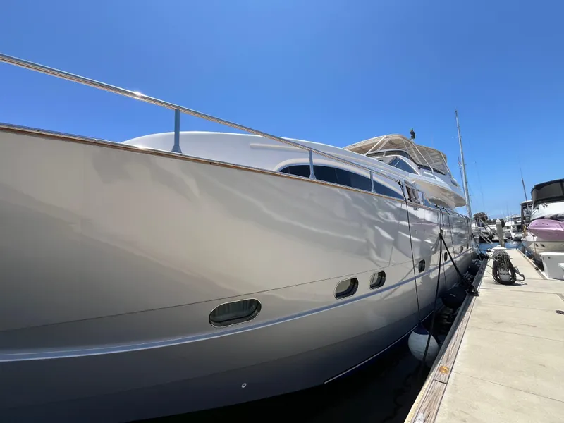 Slide: The Image of Luxury 2001 Astondoa 95GLX yacht docked under clear blue sky. - 3