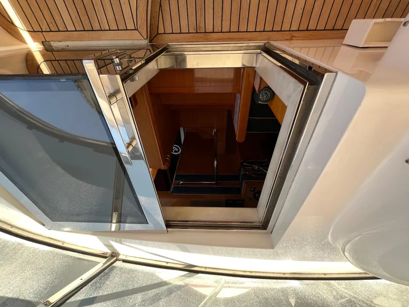 Slide: The Image of Open hatch on 2001 Astondoa 95GLX yacht, showcasing wooden interior and sleek design. - 30