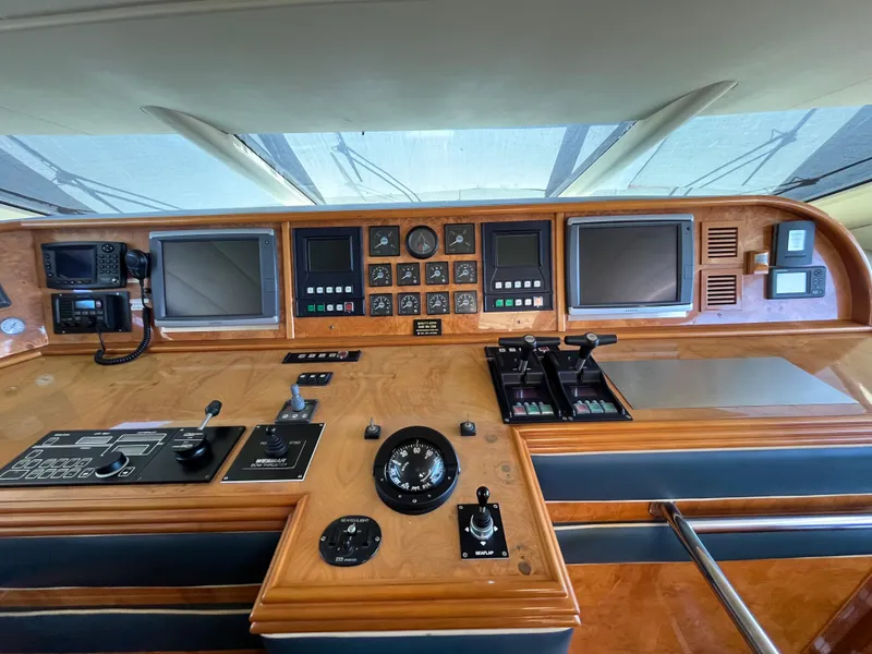 Slide: The Image of Control panel of a 2001 Astondoa 95GLX yacht with navigation instruments and displays. - 31