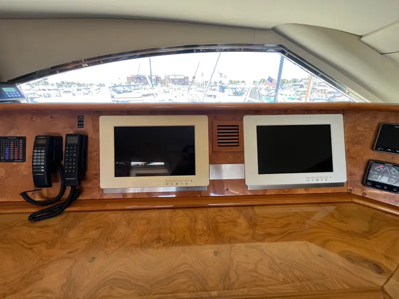 Slide: The Image of Control panel of 2001 Astondoa 95GLX yacht with screens and communication devices. - 33
