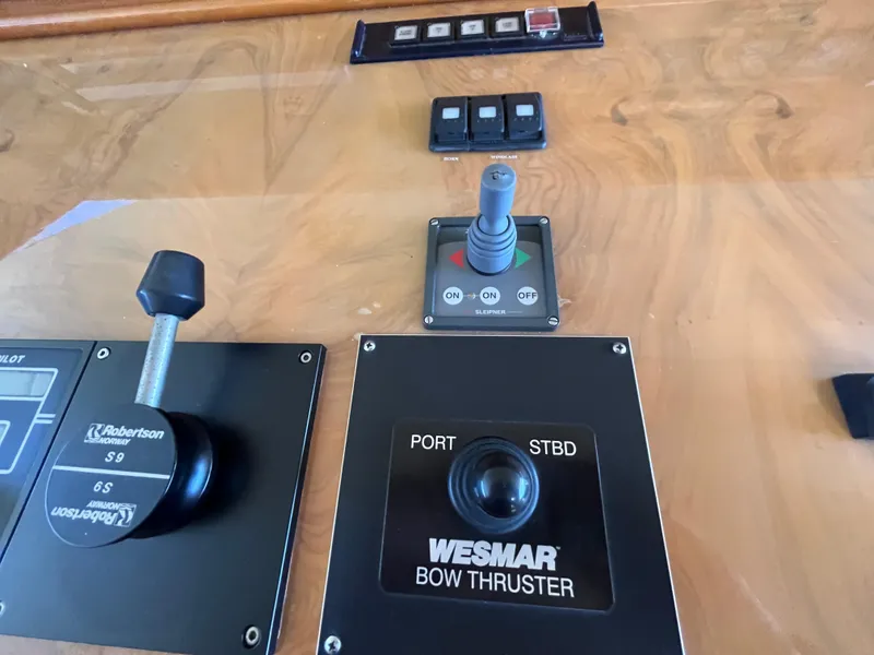 Slide: The Image of Control panel of a 2001 Astondoa 95GLX yacht featuring Wesmar bow thruster controls. - 34