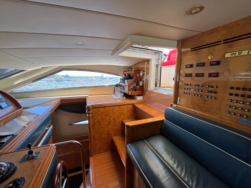 Slide: The Image of Luxurious interior of 2001 Astondoa 95GLX yacht with control panel and seating area. - 35