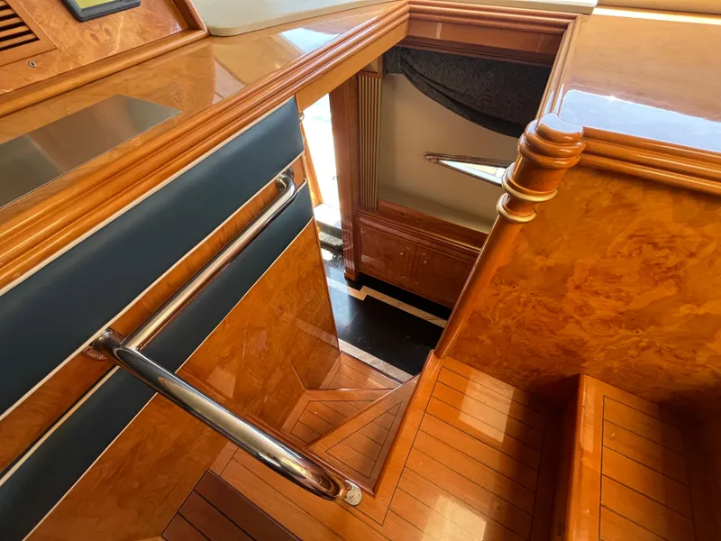 Slide: The Image of Wooden staircase inside 2001 Astondoa 95GLX yacht, featuring polished handrails and elegant design. - 36