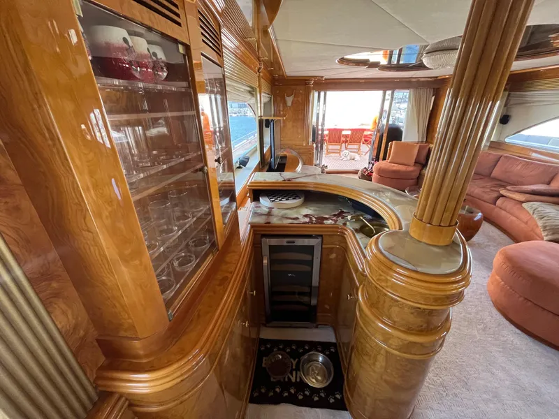 Slide: The Image of Luxurious interior of 2001 Astondoa 95GLX yacht with elegant wood finishes and plush seating. - 40