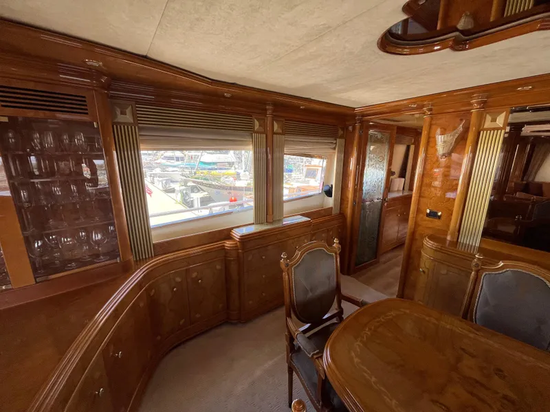 Slide: The Image of Luxurious interior of 2001 Astondoa 95GLX yacht with elegant wood finishes and dining area. - 41