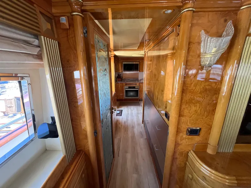Slide: The Image of Luxurious interior of 2001 Astondoa 95GLX yacht with wood paneling and modern amenities. - 42